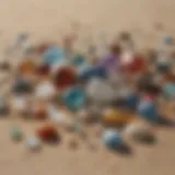 A diverse collection of polished beach gemstones displayed on a sandy background.