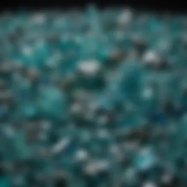 A collection of various blue-green crystals displayed in natural light