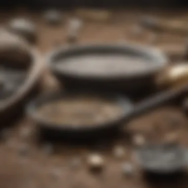 A collection of tools and accessories for gold prospecting alongside a pan