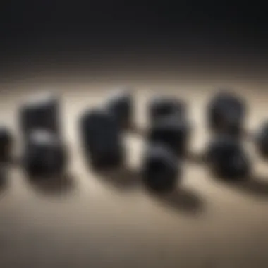 Natural black tourmaline stones set against a neutral background.