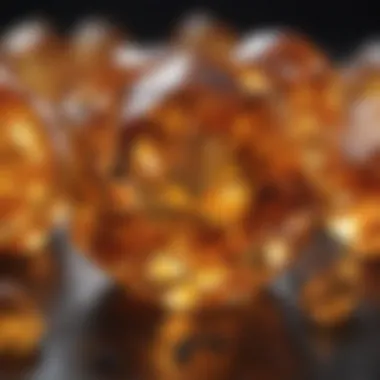 A close-up of a fiery citrine with intricate facets reflecting light