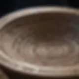 An exquisite large stone bowl intricately carved with ancient patterns