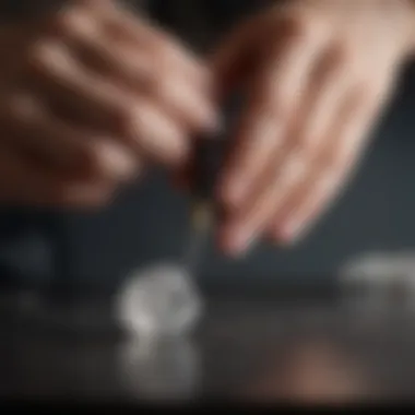 An individual performing a hardness test on a mineral specimen with a Mohs hardness test kit.