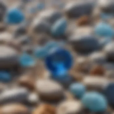 Close-up of a vibrant blue beach gemstone nestled among pebbles.